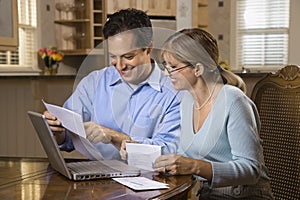 Couple Paying Bills Online photo