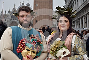 Couple of people dressed up for the Venice Carnival wearing Baco and Ariadna costumes photo