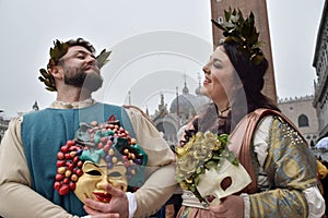 Couple of people dressed up for the Venice Carnival wearing Baco and Ariadna costumes photo