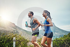 Couple, people and smile with running for fitness or training, support and love in Brazil. Workout, exercise and outdoor