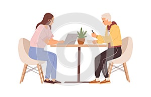 Couple of people working online with laptop and mobile phone. Man and woman sitting at table in cafe, using computer and