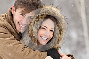 Couple with perfect teeth in winter