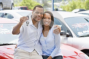 Couple picking up new car