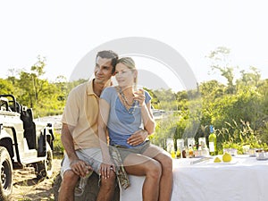 Couple On Picnic During Safari By Jeep