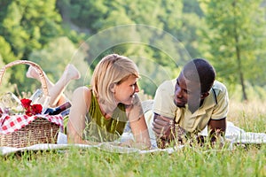 Couple picnicking in park photo