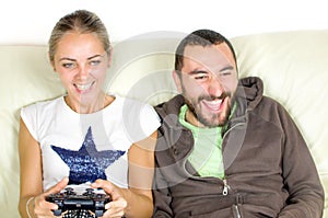Couple play videogames man encourages girlfriend play videogames photo