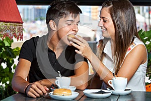 Couple playing around at breakfast.