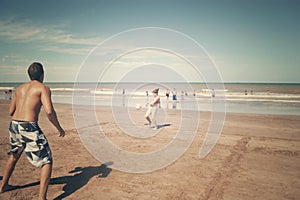 Couple playing ball in a beach