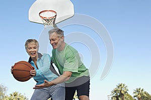 Couple Playing Basketball