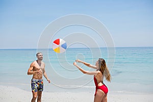 Couple playing with beach ball