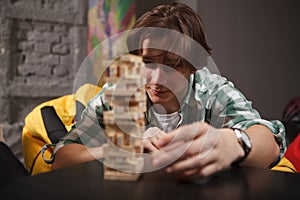 Couple playing building wooden blocks together on a date