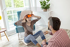 Couple playing charades at home