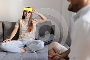 Couple playing charades at home