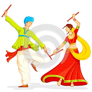 Couple playing Dandiya