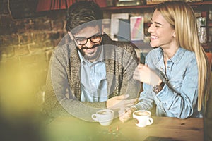 Couple playing game at cafe.