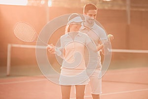 Couple playing tennis