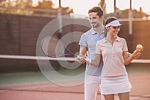 Couple playing tennis