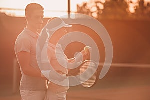 Couple playing tennis