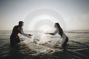 Couple playing in the water