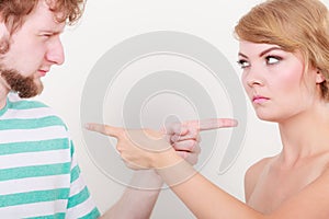 Couple pointing fingers at each other, conflict