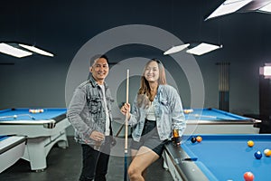 couple pool player take a break after playing billiard together