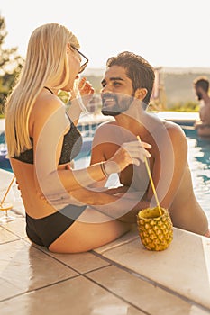 Couple at a poolside party