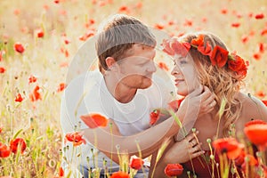 Couple on the poppy meadow