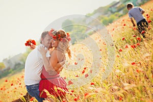 Couple on the poppy meadow