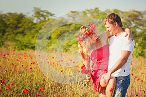 Couple on the poppy meadow