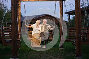 Couple on porch swing.