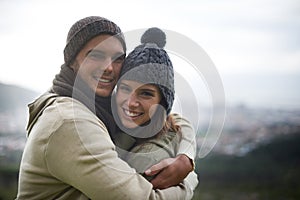 Couple, portrait and happy outdoor with hug for bonding, love and relationship with travel or holiday. Man, woman and