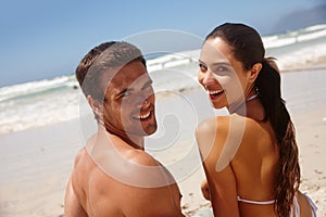 Couple, portrait and smile by beach with travel for bonding, summer vacation and anniversary getaway on sand. Man, woman