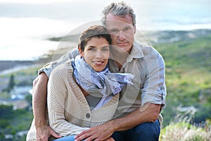 Couple, portrait and smile outdoor with hug for romance, love and relationship in nature with relax. Mature, man and