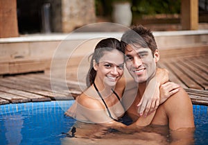 Couple, portrait and swimming pool relax for travel vacation in Hawaii for honeymoon holiday, bonding or stress relief
