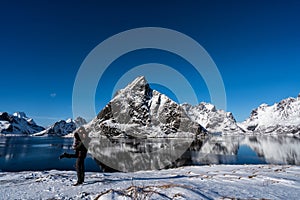 Couple posing in the mountains of the Lofoten Islands. Reine, Norway