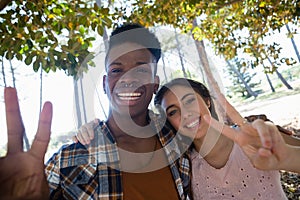 Couple posing together in the park