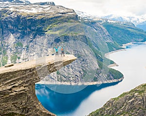 Couple posing on Trolltunga Norway