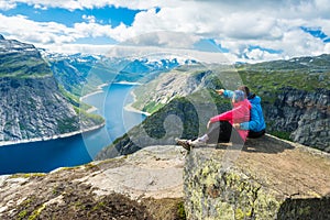 Couple posing on Trolltunga Norway