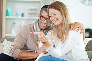 couple with positive home pregnancy test