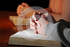 Couple Praying Bibles