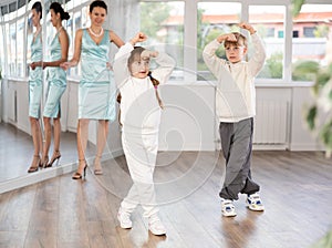 Couple of preteen dancers practicing flamenco during dance lesson