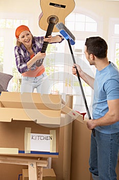 Couple pretending to fight at moving house photo