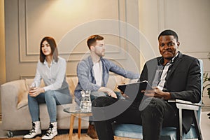 Couple at pshycologist appointment sitting in modern office