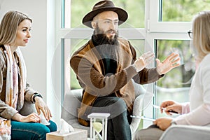 Couple with psychologist in the office