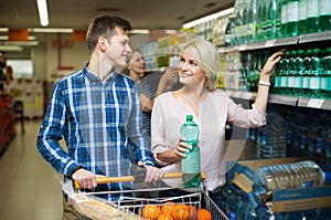 Couple purchasing mineral water