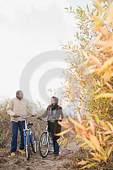 The couple pushing bicycles