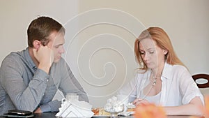 Couple quarrel in a cafe, separation, emotional conversation. Man and woman