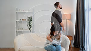 Couple quarrel. Sad frightened woman feel desperate jealous husband angry man shouting accusing talking to wife