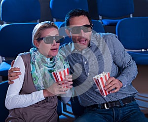 Couple reacting to a 3D movie
