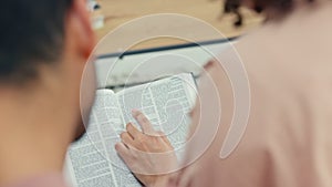 Couple, reading bible for support or help with problem, guidance or prayer and worship. Faith, religion and spiritual